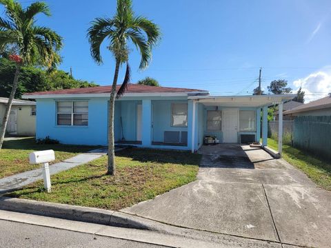 Photo of 1119 W 32nd Street, Riviera Beach, FL 33404 (MLS # R11137090)
