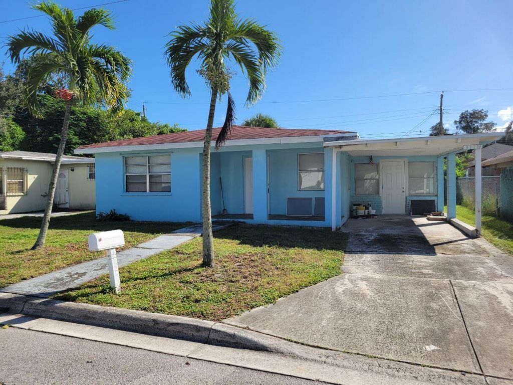 Photo of 1119 W 32nd Street, Riviera Beach, FL 33404 (MLS # R11137090)