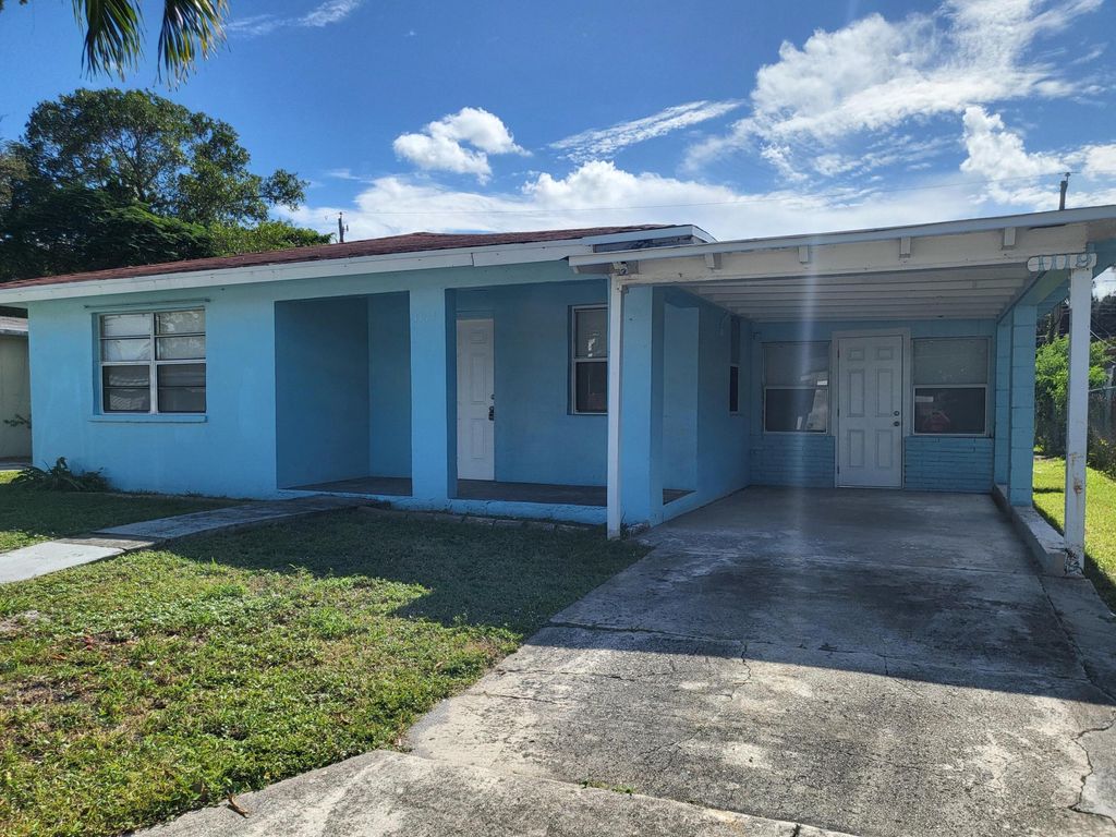 Photo of 1119 W 32nd Street, Riviera Beach, FL 33404 (MLS # R11137090)