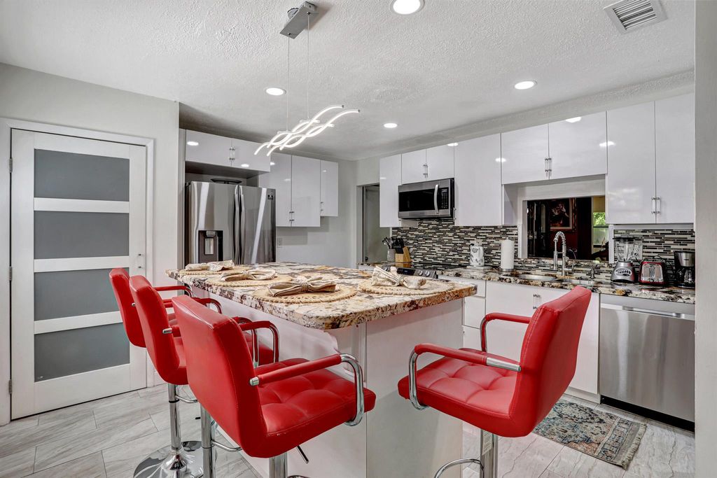 Photo of 4745 Satinwood Trail, Coconut Creek, FL 33063 (MLS # R10923631)