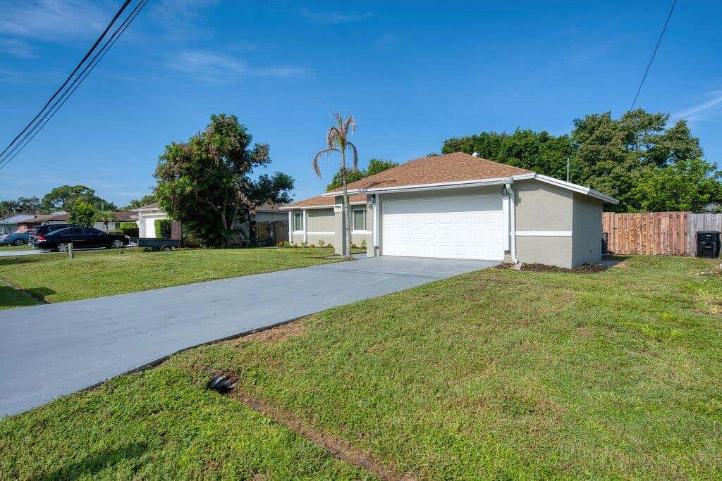 Photo of 2410 SE Warwick Street, Port Saint Lucie, FL 34984 (MLS # B26065464)