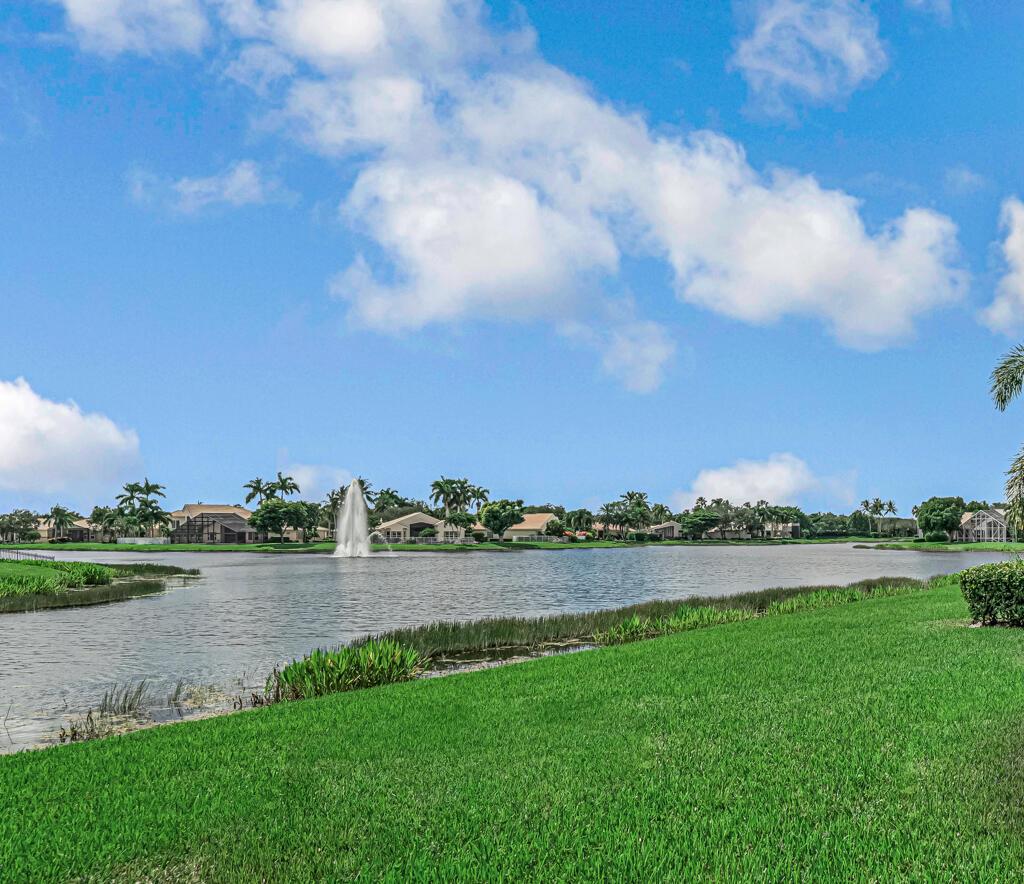 Magnificent MAIN LAKE WITH FOUNTAIN VIEWS make this 4 bedrm, 2 1/2 bath model home one of the most desirable in the community! A rare find, gorgeous marble floors & double entry doors greet you with light and bright open, airy space throughout! Gorgeous new lighting fixtures, LED high hats, super high ceilings, & a huge screened lanai with beautiful flooring , privacy overlooking water water everywhere create instant peace & serenity! No carpeting! Accordian shutter protection throughout! Walk to clubhouse, social tropical pool, full Serv restaurant, 6 pickleball crts, 3 Bocce crts! 10 tennis crts, 2 indoor racquetball CRTs, indoor whirlpool,resistance pool, lap pool too! Suana,steam, massage, Beaty salon, STATE OF ART FITNESS CTR! Country club lifestyle without the dues! LOVE THIS HOUSE!