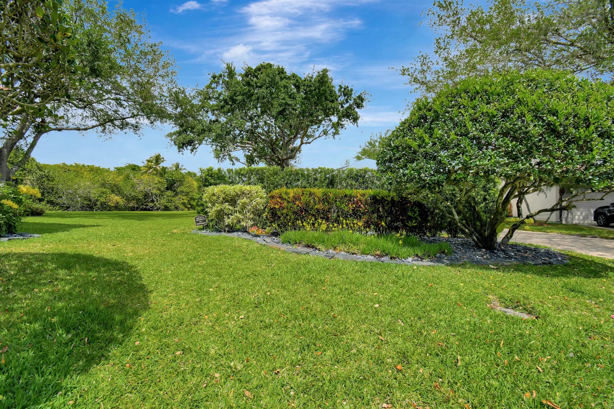 9076 sq. ft. vacant residential corner lot with water views, lawn & garden. It is zoned for a single family home build with underground electric, water and cable availability. Front entrance to lot is situated on a cul-de-sac in a small gated community. HOA fees only $195 month. Low flood zone. 5 minutes to I-595, Jacaranda Golf Club & Central Park. 13 minutes to Fort Lauderdale Int'l airport.