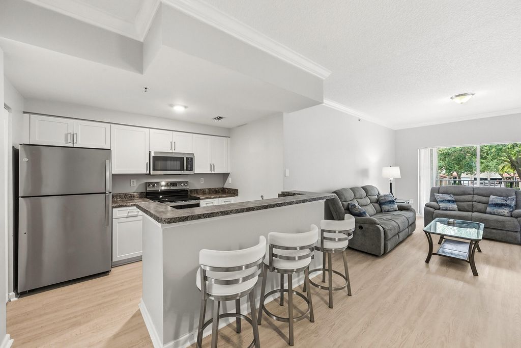 Photo of 5820 W Sample Road #206, Coral Springs, FL 33067 (MLS # B26034665)