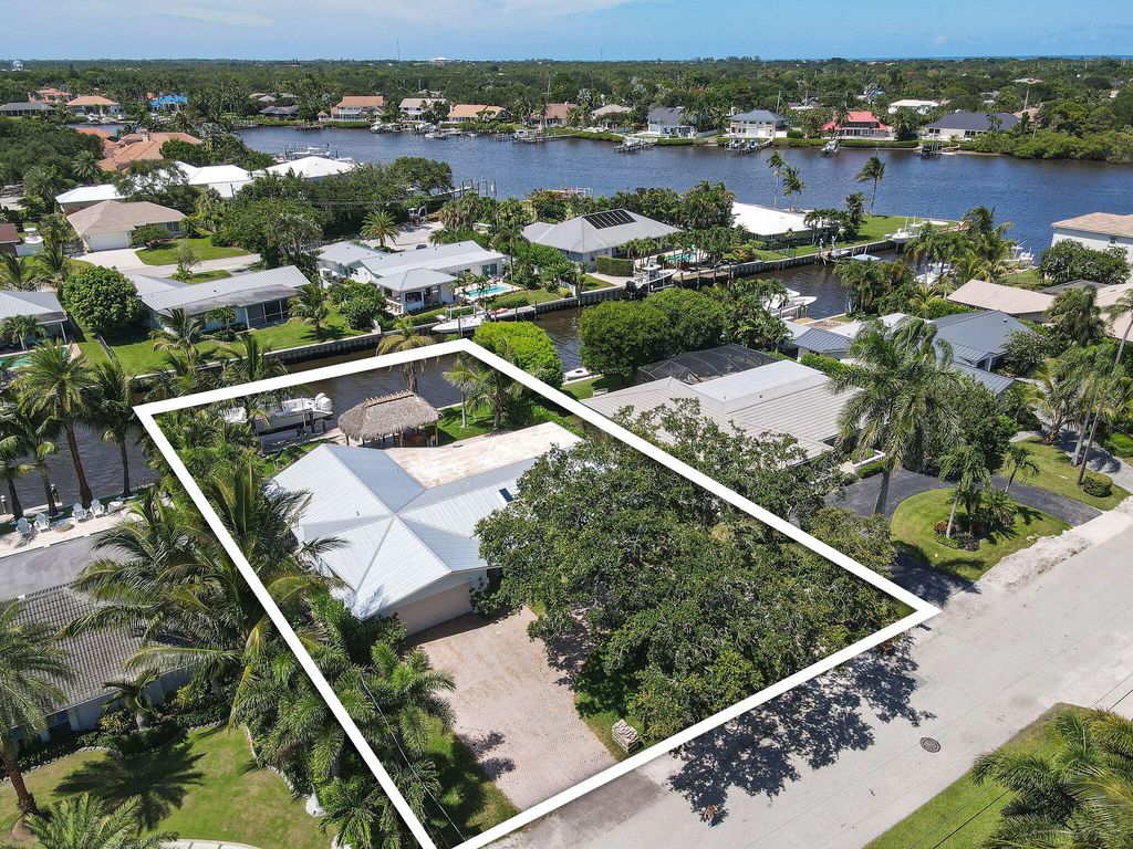 Photo of 15 Tradewinds Circle, Tequesta, FL 33469 (MLS # R10999762)