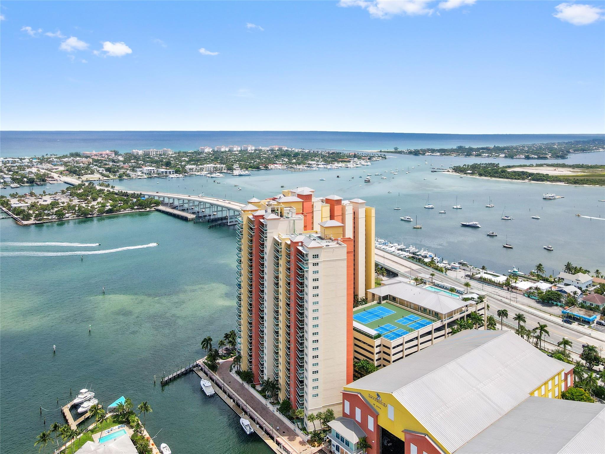 SEASONAL RENTAL - Available 11/1/25 - 4/30/26. Beautiful rooftop pool deck with large spa, BBQ areas, lounge area with fireplace, glass railings to enjoy the panoramic views. Roofdeck also includes tennis court, pickleball courts, fitness center, billiards, etc. Manned gate is 24/7, valet parking available. This 3-bedroom unit is beautifuflly furnished and the views of the intracoastal and the ocean are incredible. Master bedroom has a King bed, walk-in closets, jetted tub, shower, dual vanities. Guest bedrooms have Queen beds and en suite bathrooms. No carpet, washer/dryer inside unit. Cable, Wi-Fi, Water included. Marina with dry docks adjacent to the bldg. Minutes to beach, airport, restaurants, shopping.