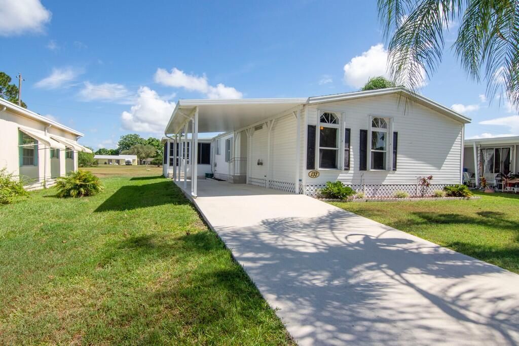 Photo of 137 E Caribbean, Port Saint Lucie, FL 34952 (MLS # R10824232)