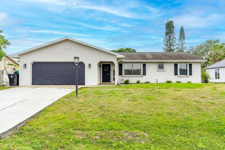 Spacious ranch-style home featuring oversized 3 bedrooms and 2 baths, offering a comfortable and functional layout. The home boasts tile and carpet flooring throughout, with vaulted ceilings adding to the open and airy feel. A split-bedroom design provides privacy, while the Florida room offers additional living space. Enjoy the outdoors with a screened pool and patio, and lush landscaping that includes banana, mango, avocado, and orange trees. Storm protection is a breeze with accordion style hurricane shutters, and the home also features gutters for effective drainage as well. A cabana bath provides easy access for poolside entertaining. Don't miss out on this well-maintained home with great features inside and out!