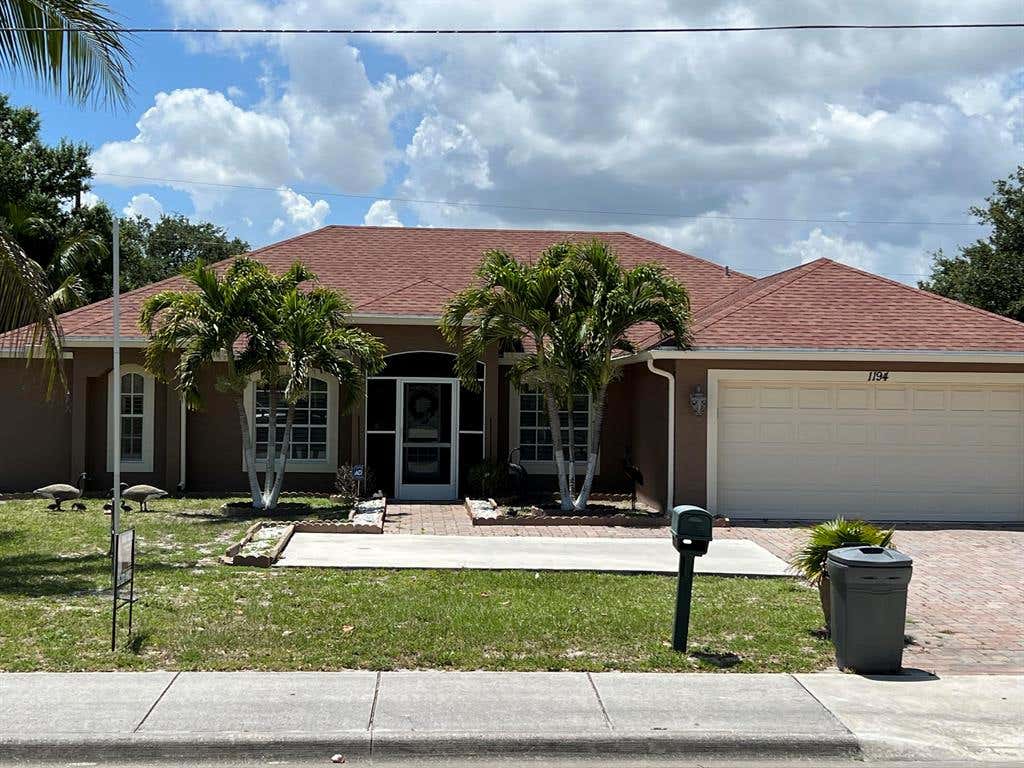 Photo of 1194 SW Airoso Boulevard Blvd, Port Saint Lucie, FL 34983 (MLS # R10797233)