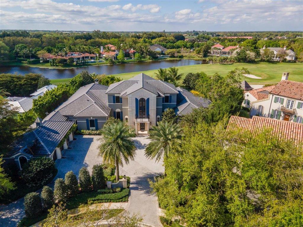 This property is extremely private on the cul-de-sac at the end of Hurlingham Drive! Featuring 5 bedrooms and 5.2 baths, it is absolutely stunning with volume ceilings and beautiful marble floors throughout. No expense has been spared on this gem! Renovation was done in 2019 - adding a relaxing salt water pool with spa and covered summer kitchen, gas fireplace and electric roll down screens. There is also a gorgeous glass wine cooler in the downstairs sitting area that can be viewed as you walk down the hall towards the office and master bedroom. The upstairs features three guest bedrooms each with full bathrooms! All three bedrooms also have a relaxing terrace to enjoy views of the golf course! Roof was also replaced in 2019. Don't let this exquisite property pass you by!!