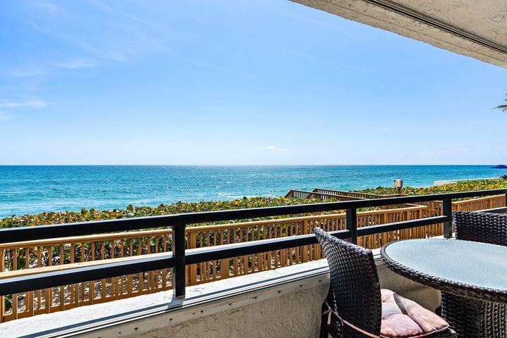 Oceanfront Corner Residence with Direct Beach AccessExperience the ultimate coastal lifestyle in this beautifully renovated oceanfront corner unit, perfectly positioned on the same level as the beach for effortless walk-out access to the sand and surf. Nestled within an intimate boutique building, this rare offering combines privacy, elegance, and the unmatched appeal of true oceanfront living.The light-filled interiors showcase  ceramic flooring, sleek quartz countertops, and modern appliances, with the residence thoughtfully appointed and fully furnished--including bedding and a complete kitchen setup for a turnkey move-in vacation retreat. Large windows and sliding glass doors frame sweeping views of the Atlantic, while wrapped private patios extend your living space .
