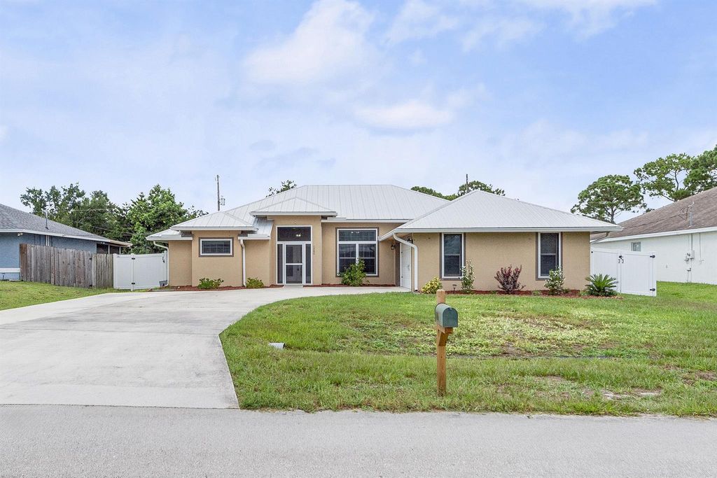 Photo of 1280 SW Kalevala Drive, Port Saint Lucie, FL 34953 (MLS # R11115867)