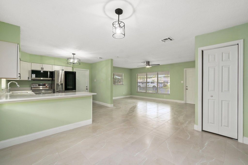 Photo of 208 E Arbor Avenue, Port Saint Lucie, FL 34952 (MLS # R10959708)