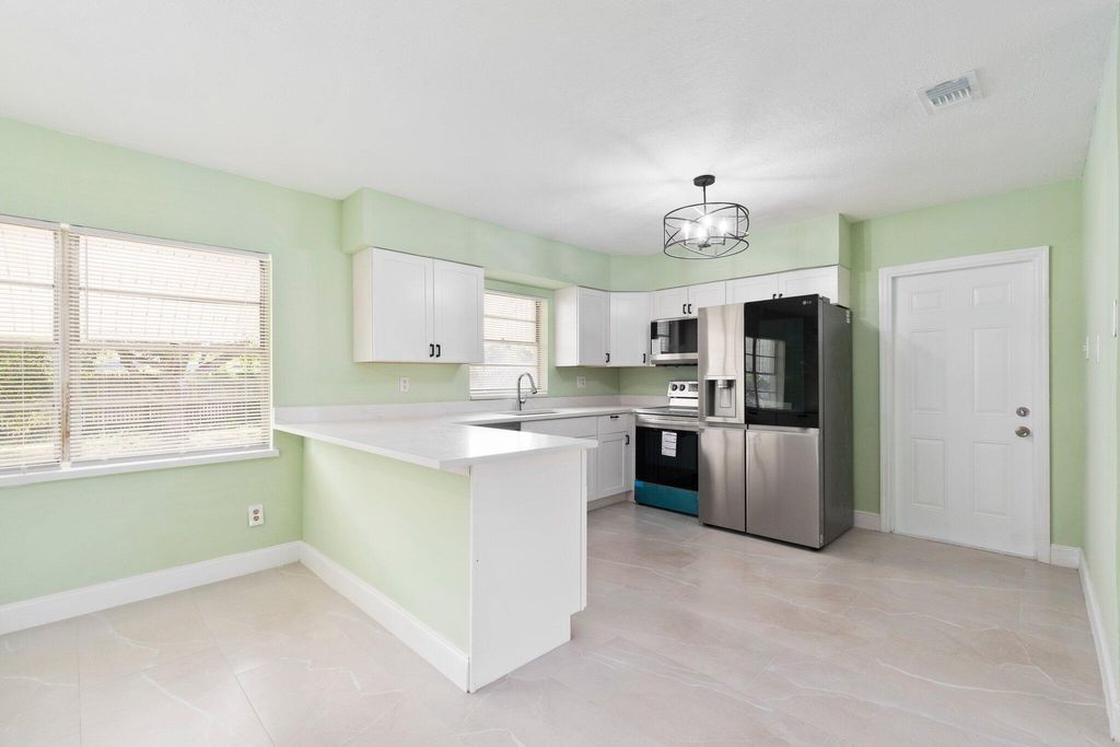 Photo of 208 E Arbor Avenue, Port Saint Lucie, FL 34952 (MLS # R10959708)