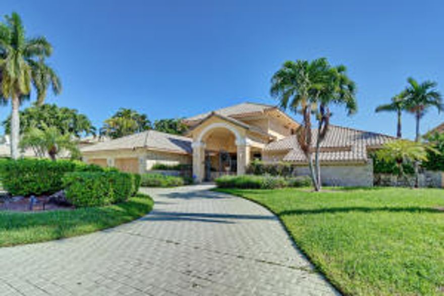 Property being sold as-is. Owner occupied. No showings without an appointment. Do not walk around the property. Intracoastal home in Royal Palm Yacht & Country Club on 100' of waterfront. Spectacular views from almost every room, this home has a huge master suite on the 2nd floor with sitting room, private balcony and large master bathroom. First floor has 3 bedrooms, 3 bathrooms, office/den, living room, dining room and family room with a screened in sun room over looking the waterway.