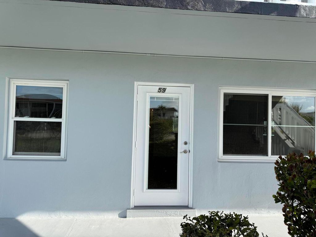 Photo of 59 Coventry C Lane, West Palm Beach, FL 33417 (MLS # B26001317)