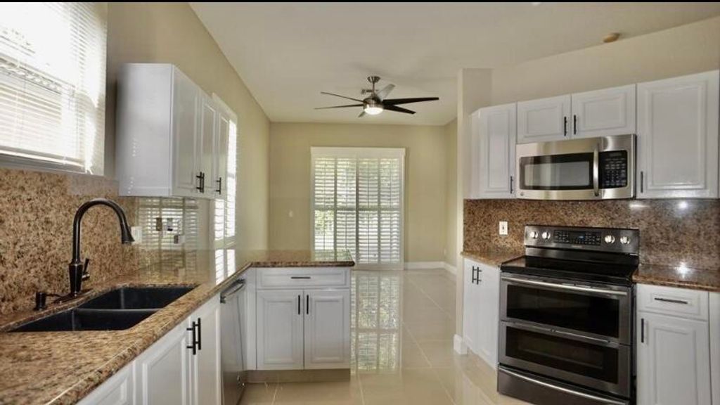 Photo of 145 Prestige Drive, Royal Palm Beach, FL 33411 (MLS # B26019674)