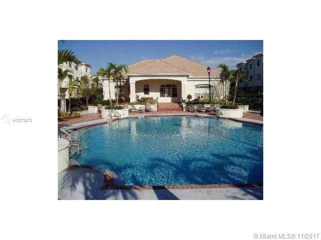 Fabulous gated community with heated pool and gym, all wood and tile floors, water included in rent, split bedroom, garden tubs, washer, dryer.