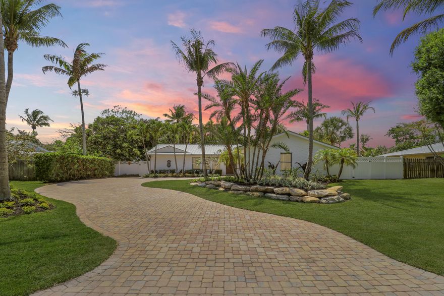 Come see this tropical pool home offering the perfect blend of comfort, style, and Florida living with no HOA restrictions. This beautifully maintained 3-bedroom, 2-bathroom home features a desirable split floor plan, impact glass windows and doors, a durable metal roof, lush tropical landscaping, a buried propane tank for the gas stove, and a house generator hookup for added peace of mind.  Step outside to enjoy the sparkling saltwater pool, relaxing hot tub, covered tiki hut, and summer kitchen designed for year-round entertaining and outdoor living. The spacious backyard also offers plenty of room for a boat or RV, along with a long paver driveway and 2-car garage, giving you the flexibility and storage space to fully enjoy the Florida lifestyle without HOA restrictions.   Inside, the h ome offers a bright and inviting layout designed for both everyday living and hosting guests. Conveniently located and zoned for highly sought-after Jupiter schools, this move-in ready property is just minutes from beaches, dining, shopping, and only 30 minutes north of Palm Beach International Airport.