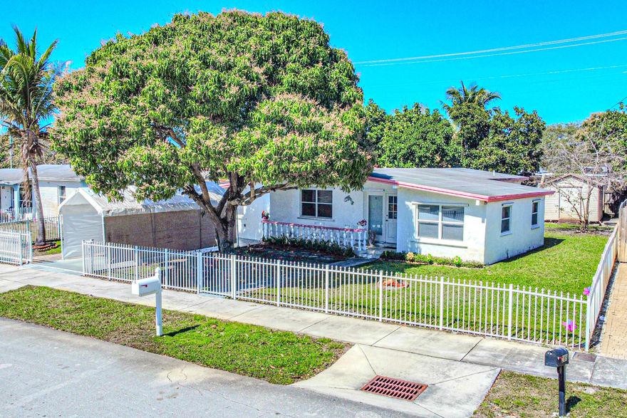 This 3-bedroom, 2-bath home sits on a beautifully maintained oversized lot with no HOA restrictions, giving you the freedom to truly make it your own. A mature mango tree and coconut tree greets you in the front yard, adding charm and character to the property. While the interior offers a more classic layout and finishes, it presents the perfect opportunity to renovate, customize, and create the home you've been envisioning -- all on a spacious lot with room to grow.