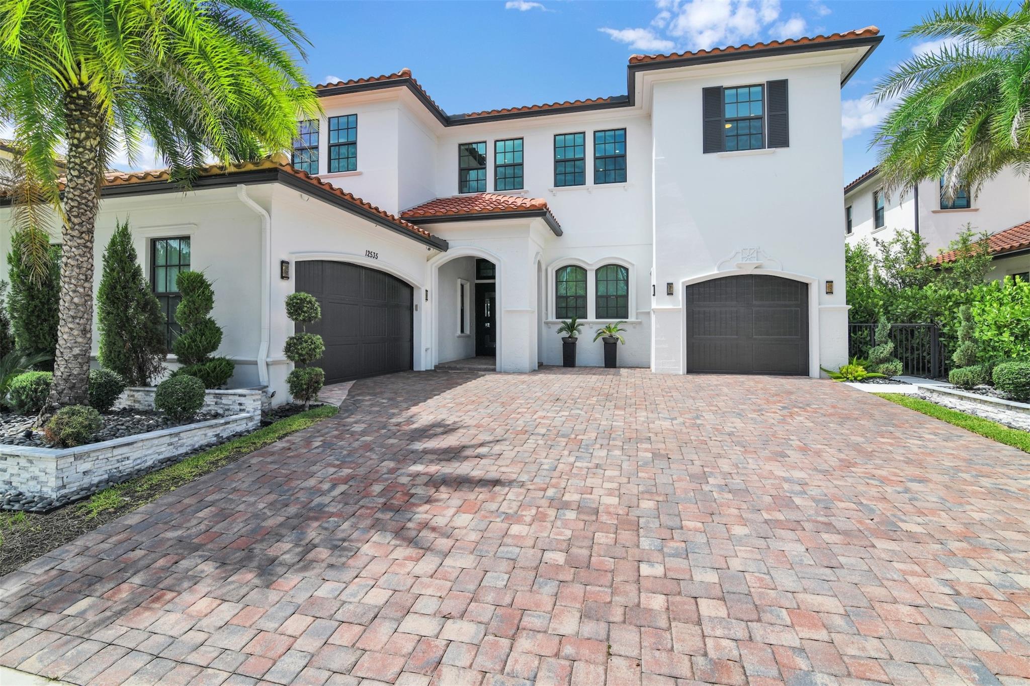Welcome to luxury living in one of Florida’s most sought-after cities—Parkland. Located in the exclusive gated community of Parkland Bay, this lakefront estate sits on an oversized lot with premier east-facing lake views.5 bedrooms, 7 baths, study, loft, and over $400K in custom upgrades. Enjoy a resort-style pool, upgraded appliances, security camera system, whole-house water filtration and softener, mosquito misting system, and sound system throughout. The summer kitchen is fully equipped, designer lighting and bespoke finishes elevate every room. Four en-suite bedrooms. Elegant office and professionally designed, illuminated landscaping. A rare opportunity to own one of the most upgraded homes in Parkland Bay where comfort, style, and exclusivity meet.