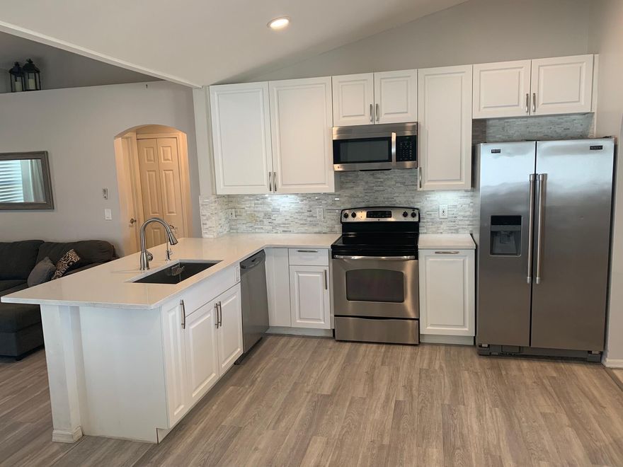 This beautifully maintained & MOVE IN READY 3 bedroom, 2 bath, 2 car garage can't wait to be yours!  Sporting a huge fenced in yard, BRAND NEW ROOF, tasteful updates.  Customized coffee bar and breakfast counter.   Customized exterior lighting within soffits.  Minutes from all the shopping, restaurants and nightlife that both Tradition and St. Lucie West has to offer. MUST SEE!!