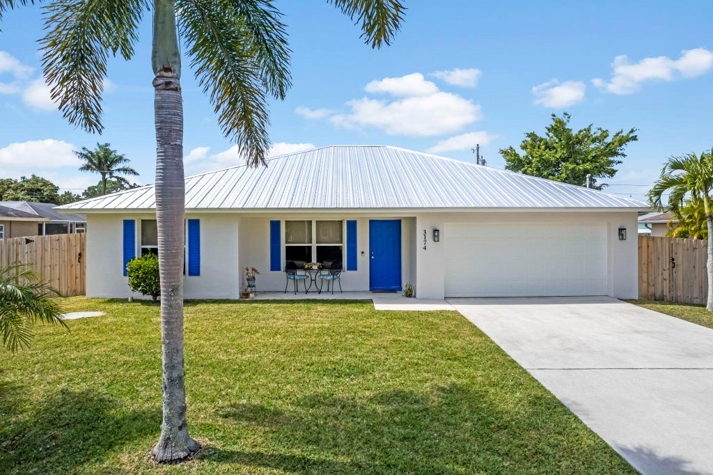 Photo of 3174 SW Crenshaw Street, Port Saint Lucie, FL 34953 (MLS # R10970112)