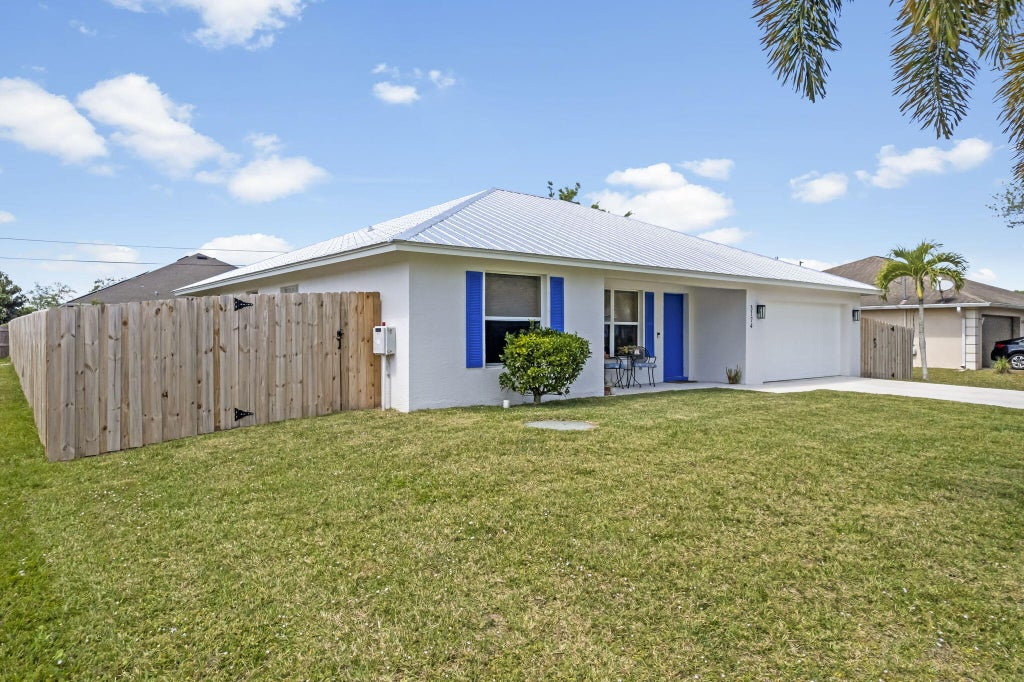 Photo of 3174 SW Crenshaw Street, Port Saint Lucie, FL 34953 (MLS # R10970112)