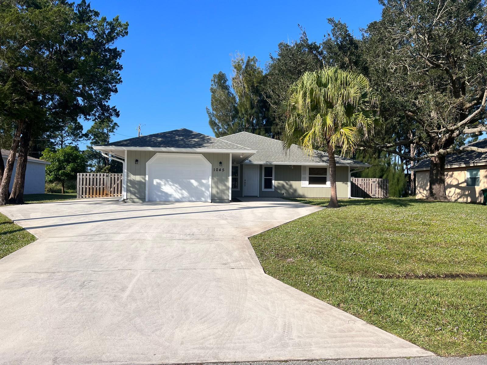 Welcome to this spectacular home in the heart of Port St. Lucie, located in the highly sought-after residential area near Gatlin Blvd. This single-story property combines comfort, space, and functionality. With 3 spacious bedrooms, 2 full bathrooms, and a split floor plan design, it offers privacy and smooth flow throughout the home.Built on a generous 10,000 square foot lot, this home features a large, fully fenced backyard -- perfect for family enjoyment, adding a pool, or creating your dream outdoor space. The interior has been recently updated, including fresh interior and exterior paint, new ceiling fans, and details that bring a modern and inviting style.