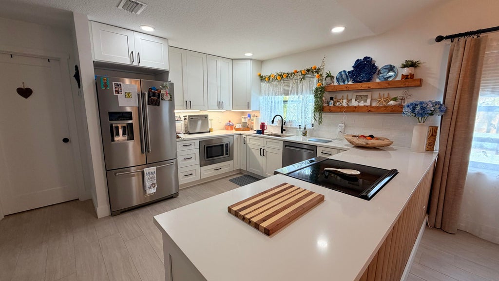 Photo of 1871 SW PALM CITY Road #G402, Stuart, FL 34994 (MLS # B26081111)