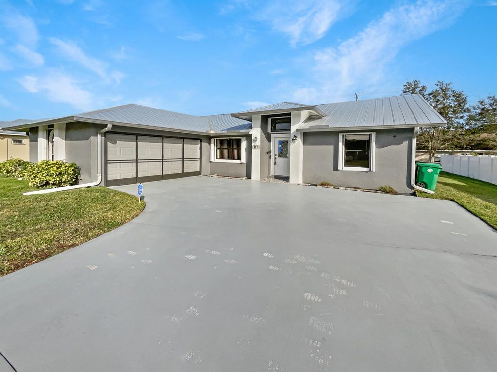 Photo of 473 SW Homeland Road, Port Saint Lucie, FL 34953 (MLS # R10949216)