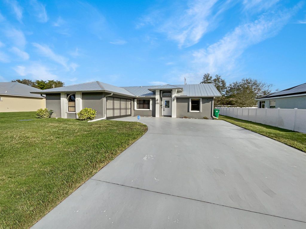 Photo of 473 SW Homeland Road, Port Saint Lucie, FL 34953 (MLS # R10949216)