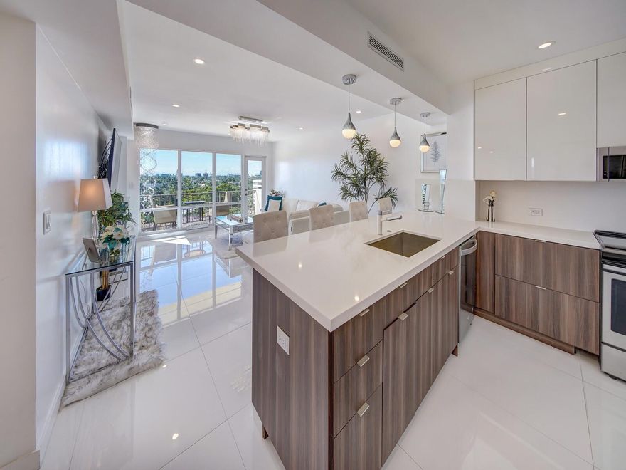 Wow, this beautiful unit is located on the famed Las Olas Blvd!  From the moment you enter you are greeted with lots of natural sunlight  and breathtaking views of the intracoastal, and ocean.  This spacious floor-plan is fully remodeled.  Spectacular modern kitchen boasting quartz countertops, real wood cabinets, S.S. appliances and upgraded Porcelain white tile throughout.  The master bedroom is complete with a huge walk-in closet.  The master bath boasts his and her sinks, seldom found in a condominium. Top-of-the-line, GE profile washer and heat pump dryer all in one!   Las Olas is the ideal location with shopping, restaurants, galleries, wine bars and more just a short walk over the bridge.