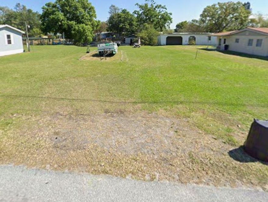Treasure Island~Price Reduced! Vacant lot with no HOA, perfectly situated on the water with direct access to Lake Okeechobee. Zoned Residential Mixed, offering versatile building opportunities. Located in town and close to everything—Publix, Home Depot, Marshalls, Tractor Supply, and more. Fantastic opportunity to build your dream home or investment property in a growing, convenient area.