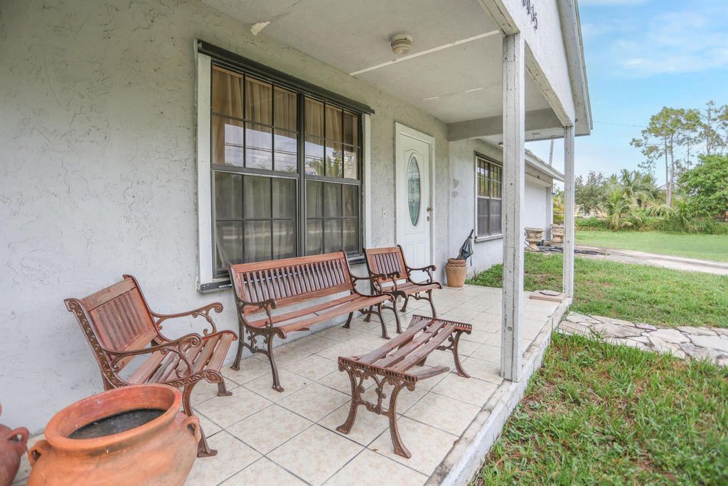 Photo of 18055 W Sycamore Drive, The Acreage, FL 33470 (MLS # R11114660)