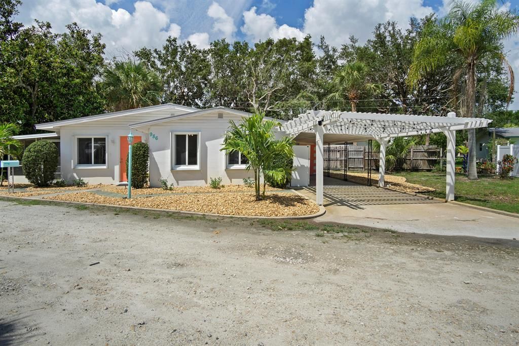 Photo of 986 NE Banyan Tree Drive, Jensen Beach, FL 34957 (MLS # R10885427)
