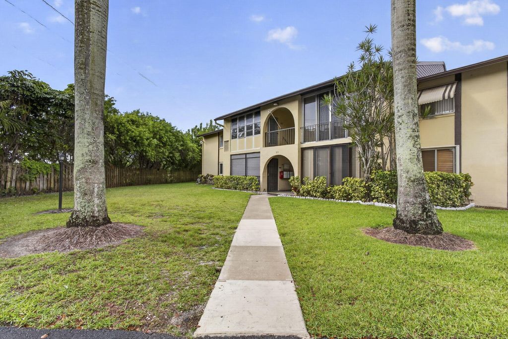 Photo of 315 Pine Ridge Circle, Greenacres, FL 33463 (MLS # B26018193)