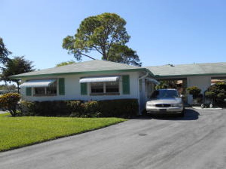VILLA W/CARPORT. LOVELY 2 BEDRM (2ND BEDRM BEING USED AS DEN) W/LARGE SCREENED PATIO. NEW LAMINATED WOOD FLOORS. FANS, LARGE WALK IN CLOSET, NEW QUEEN BED, EAT IN KITCHEN (NO DISHWASHER)