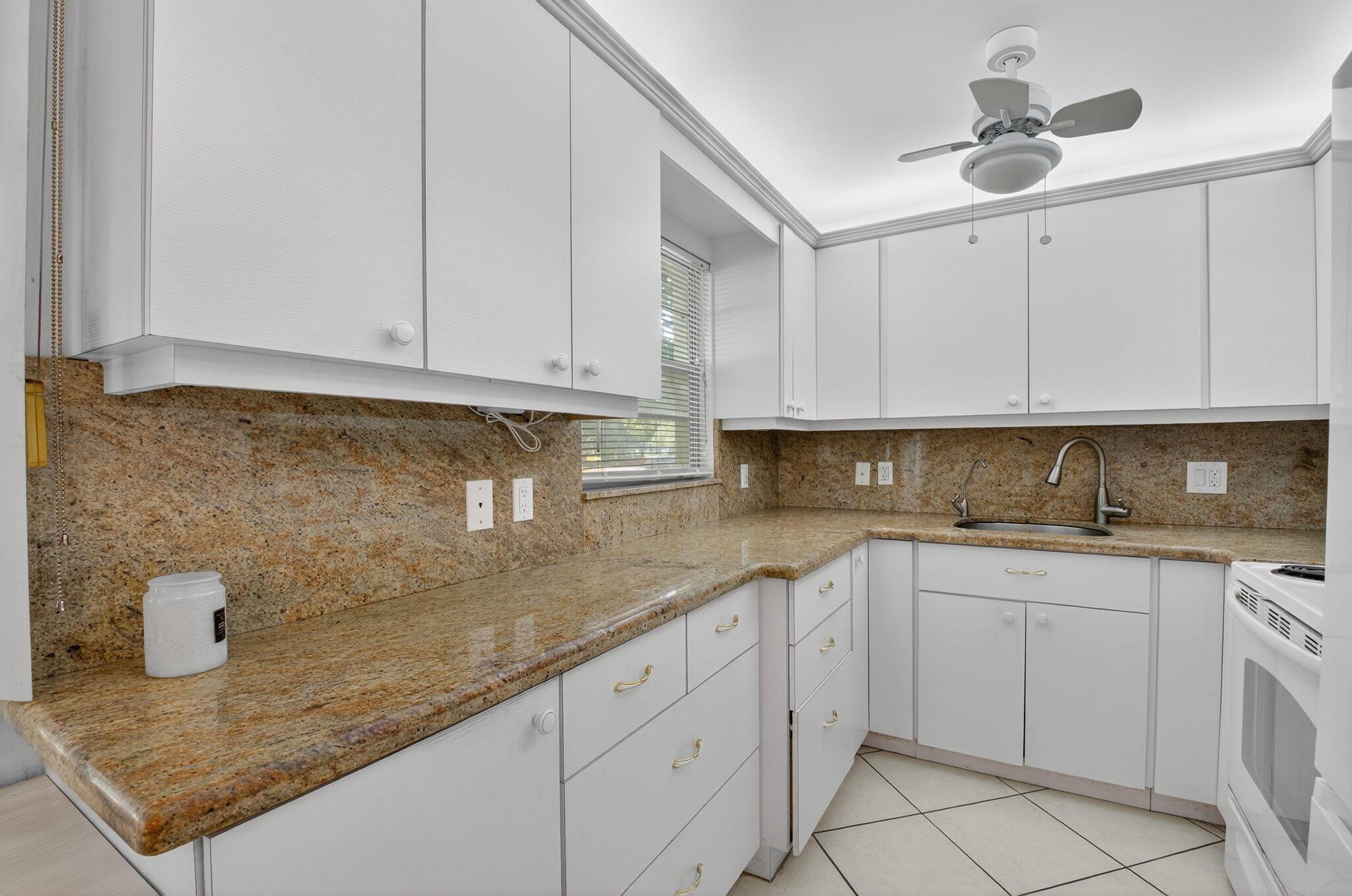 FIRST floor, CORNER unit, partially furnished.2 bedroom, 1.5 bathrooms - Upminster E condo in a very desirable building due to it's very close walk proximity to house of worship. Selling as is - Bright patio, spacious living room area and bedrooms. Lots of closet space. Built in wall unit in the Second bedroom. Relax on the enclosed patio with a garden view. Amenities include club house, large swimming pools, theater, tennis, free transportation and much more in this resort style 55+ community in Century Village Deerfield Beach.