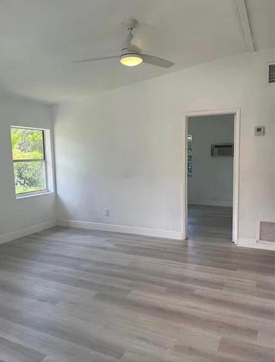 New renovated, bright, open and airy 2BED/1BATH home. Home features 2 spacious bedrooms, 1 full bathroom, a Family Room/Dining Room, a large Eat-In Kitchen, Washer & Dryer. Brand NEW AC unit interior and exterior! Brand NEW hot water heater! New laminate wood floors throughout, new stove/oven combo, refrigerator. Freshly painted interior and exterior of the home, six parking spaces - great for trailers or boats! Gorgeous lush fenced in back yard - perfect for pets to run around.