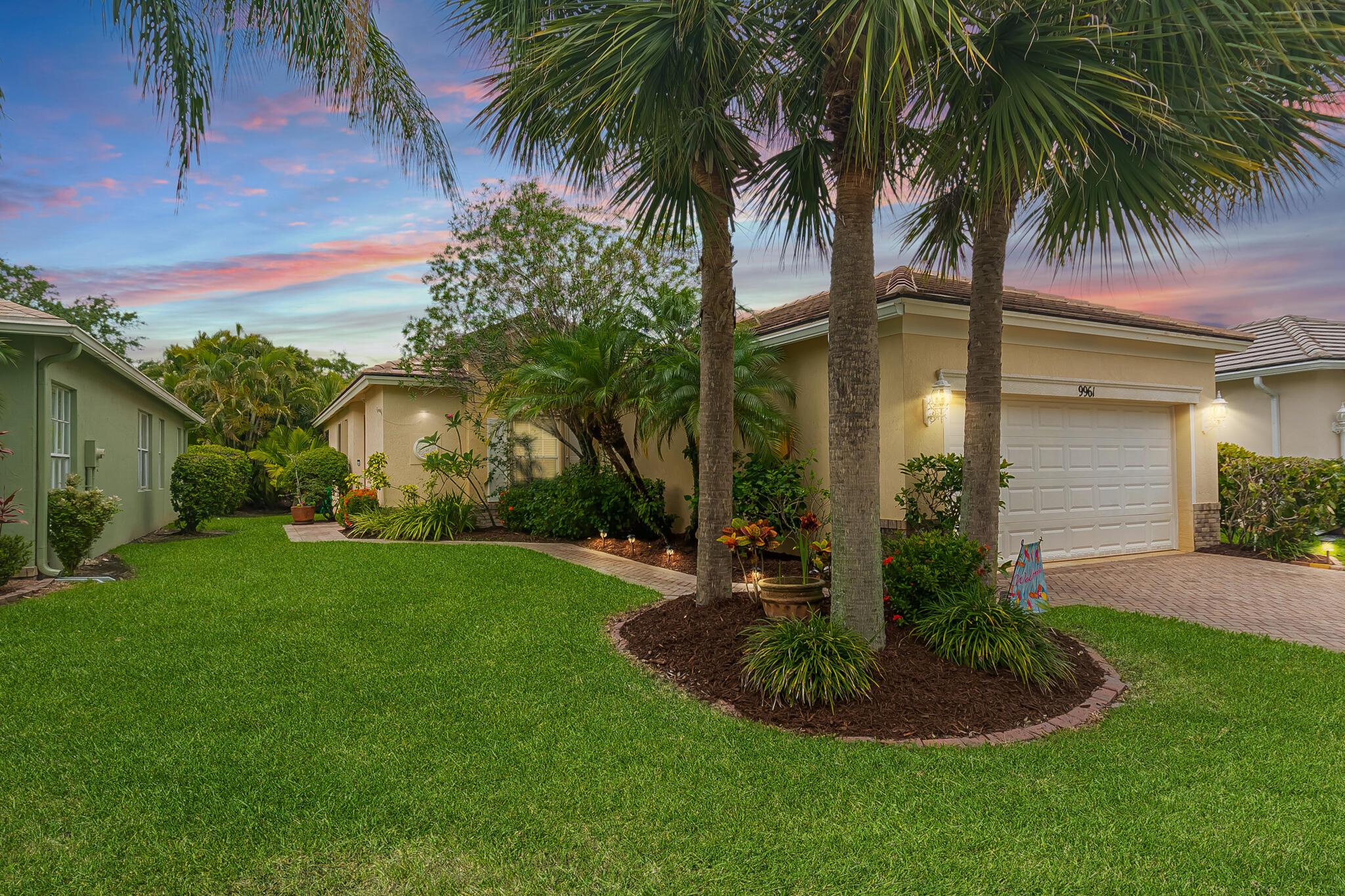 Heritage Oaks! Inviting 2/2/2 with flex room home is available now! Tile floors throughout, open layout. Updated baths. Big kitchen has granite counters, plenty of cabinets, pantry, stainless appliances. A private oasis awaits with the extended covered and screened lanai and walkway, lush landscape. Accordion hurricane shutters. Fantastic community amenities - heated pool, fitness center, play areas, more -- lawn care, cable, pest control included with HOA dues. Close to all Tradition has to offer.