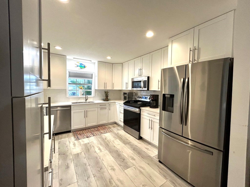 Photo of 440 Franconia Circle, Lake Worth, FL 33467 (MLS # R11025951)