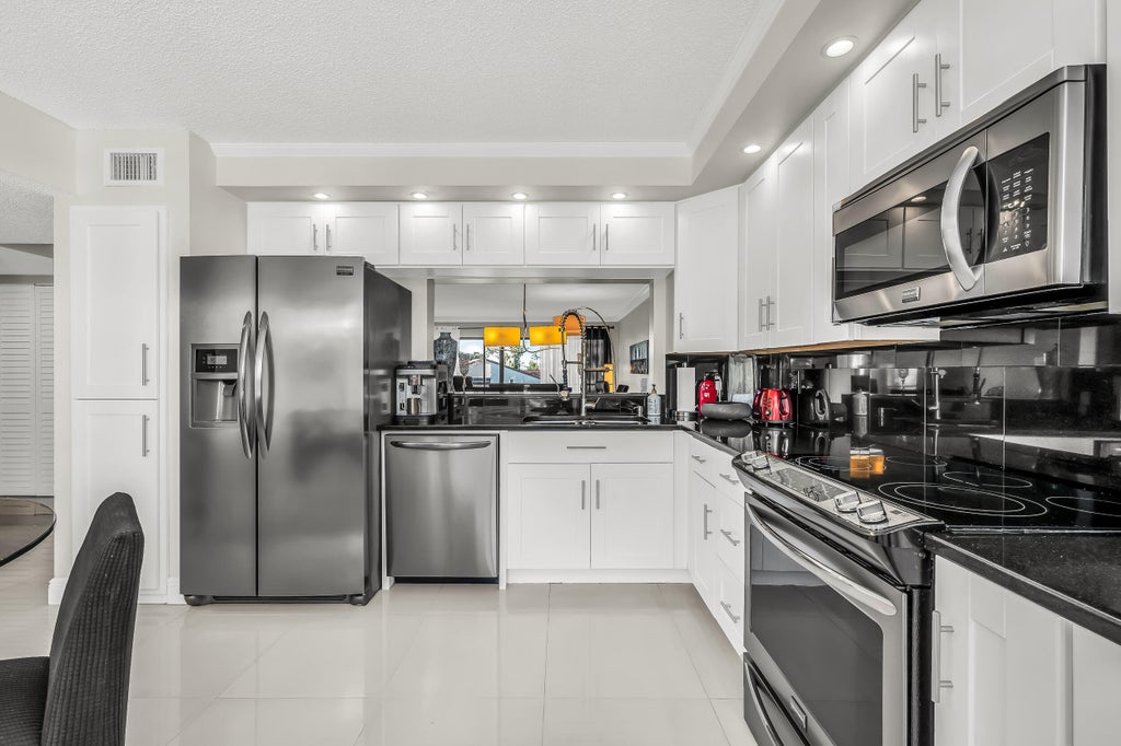 Photo of 5757 Fairway Park Court #202, Boynton Beach, FL 33437 (MLS # R11104927)