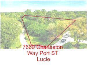Last .77-acre estate lot among million-dollar homes in PGA Village. Golf club with beautiful club house, pool and all amenities. Treed, level, see attached landscape plan showing proposed 3,318 sf home with 6 car garage, approve by HOA. Complete set of custom plans included, ready to build. All custom PGT window package available. Custom builder will build home for buyer.