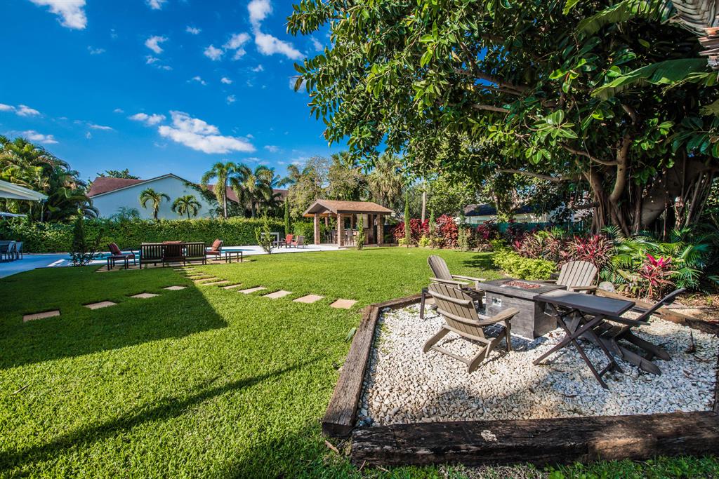 101 Alhambra PlaceSplendor in the grass revealsthe luxury hideout at 101 AlhambraPlace, set in the heart of the Southend ('SoSo') neighborhood,a remodeled build,Pavilion - style, and only a short stroll to the Flagler Intracoastal Waterway. In decorated interiors of flagstone tiles and organic glass walls, your space reveals a refined indoor -outdoor oasis in West Palm Beach, Fla. A one-story layout of 2,858-square-feet gives way to entertaining.The elegance of your dwelling arecomforts revealed by imported marble floors throughout, spa-inspired master bath, a series of terraced poolside bedrooms,plus a private entrance guest suite. The ample gourmet kitchenof this airy open design residence is a main draw.Outdoors captivates for its tropical,meandering,expansive manicured