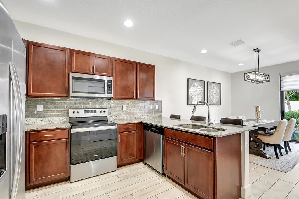 Photo of 4015 Screw Pine Cove, Riviera Beach, FL 33410 (MLS # R10951205)