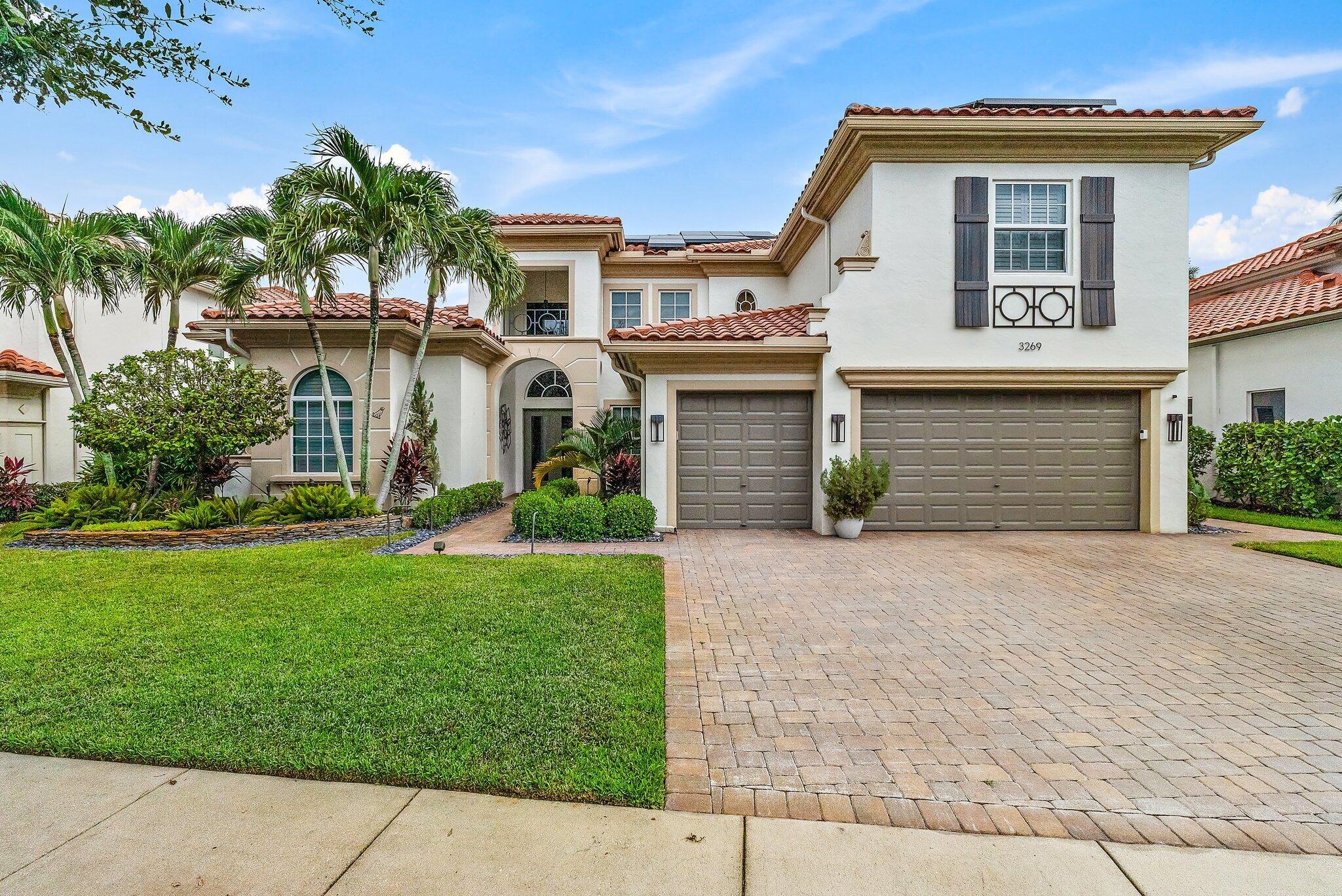 This exquisite, meticulously-maintained Mizner-inspired estate is a must see! Located in the Talavera community, this 6 bedroom 5.5 bathroom home has updates and extras galore! The entrance, foyer, and living room have towering ceilings that look out onto the large swimming pool and spa which are completely screened in. The expansive travertine deck and covered patio are ideal for entertaining. The back yard is surrounded by privacy hedges and has low-maintenance artificial turf. The open plan chef's kitchen centers around a Wolf gas range and oven along with a Bosch refrigerator, Bosch wall-mounted speed/ microwave and conventional oven and Bosch dishwasher. Counter tops and backsplash are done in a very