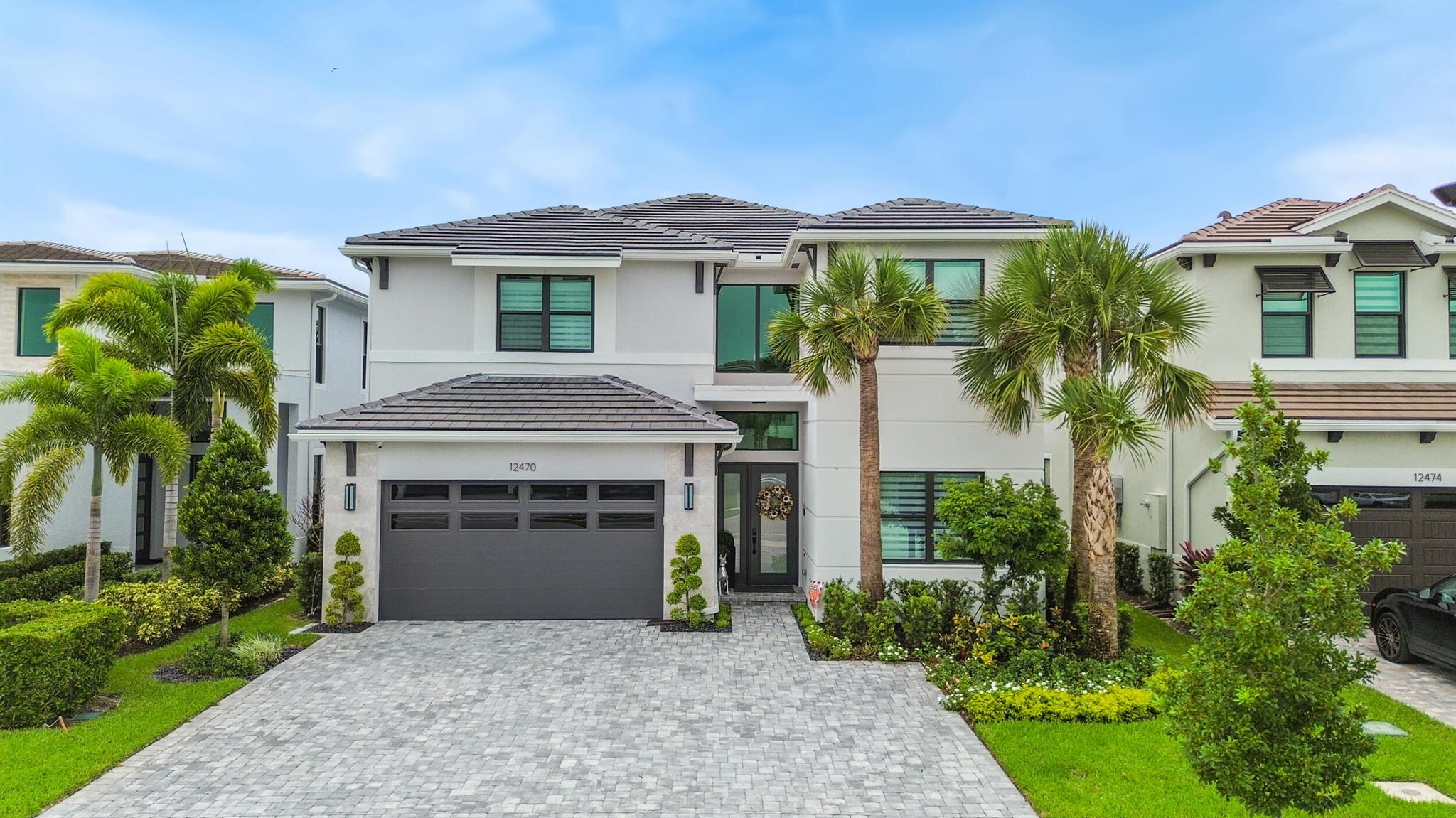 Come see this magnificent fully furnished upgraded  home  featuring 5 bedrooms, 6 full bathrooms, theater room , game room and a spacious two-car garage with built in storage cabinets . Designed for contemporary living, the open floor plan creates a seamless flow, complemented by generous walk-in closets and a beautifully crafted gourmet kitchen. A grand view of the lake and a fenced backyard offer the perfect space for outdoor entertainment. Additional upgrades include  motorized Stylish custom window treatments and sophisticated light fixtures , sonos sound system and  outdoor mosquito misting spray.  New adjacent shopping center Publix anchored opening in January 2025- Amenities galore at the main clubhouse.