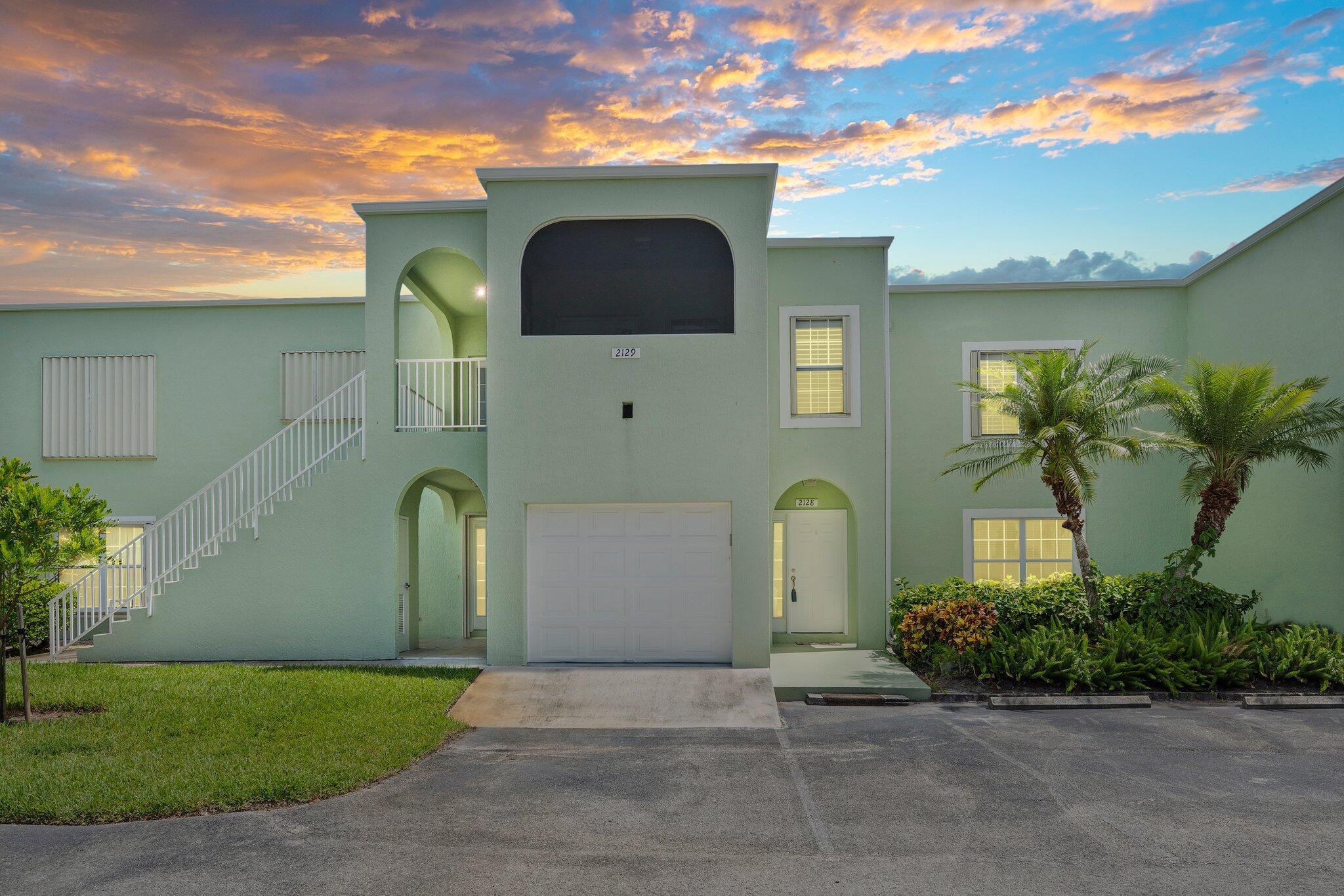 Welcome to this spacious 2-bedroom, 2-bath first-floor condo, offering comfort, convenience, and value in a peaceful, well-maintained community. This home features all tile flooring throughout, a generously sized kitchen with abundant cabinetry, and an enclosed porch that adds extra living space -- perfect for a sunroom, office, or casual relaxation.Practical updates include a 2022 water heater and A/C, ensuring energy efficiency and peace of mind. Accordion storm shutters make storm prep simple and stress-free.The community offers resort-style amenities including a large outdoor pool with hot tub, ample seating for guests, a clubhouse with a fitness center, sauna, and private showers. One of the standout features of this unit is its attached garage with an automatic door