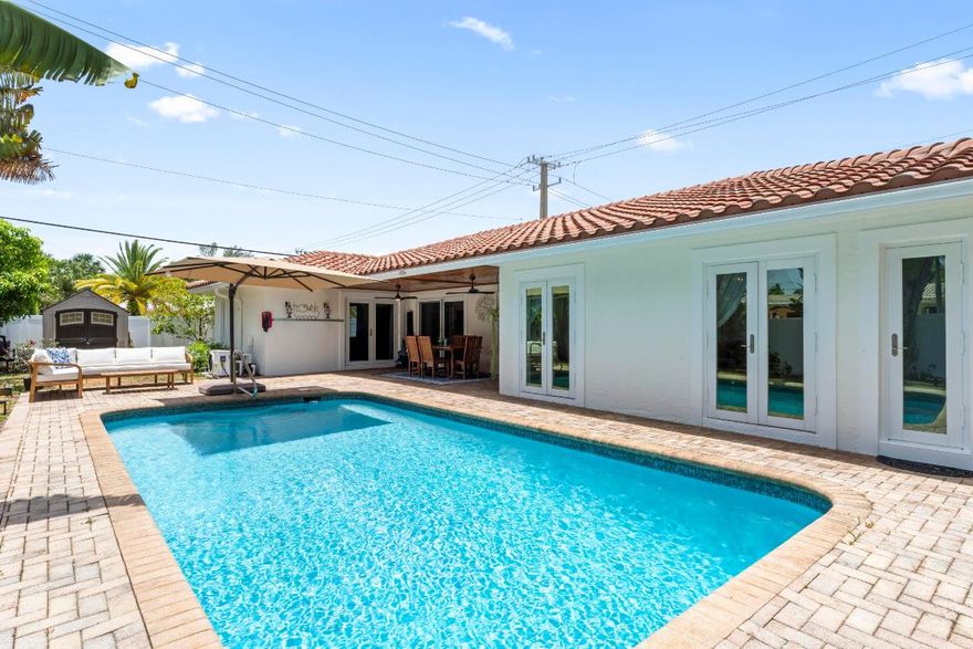 Charming East Boca home with a private pool in the sought-after Bel Marra neighborhood! This beautifully updated 3-bedroom, 3-bathroom single-family residence sits on a rare quarter-acre corner lot, offering a perfect blend of comfort, style, and convenience. Inside, you'll find a fully upgraded interior featuring impact-resistant glass, luxury vinyl flooring throughout, and a modern open-concept kitchen with charming finishes that flows seamlessly into the main living area overlooking the vibrant pool.

A second spacious living room with a large bay window fills the space with natural light, creating a warm and inviting atmosphere. All three bathrooms have been tastefully updated, including a convenient cabana bath with direct access to the private pool, which features both heating and cooling optionsideal for relaxing or entertaining year-round.

Located just ten minutes from Atlantic Avenue and Mizner Park, and surrounded by A-rated schools, this home offers the ultimate East Boca lifestyle. It can be offered partially furnished as shown or unfurnished to suit your needs. Don't miss this fantastic opportunity to enjoy one of Boca Raton's most desirable neighborhoods!